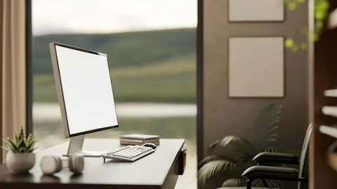 Blank screen computer on table and chair aside empty frames on wall in a st.. Stock Illustration