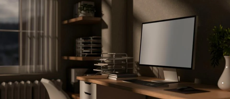 A blank screen computer on wooden table with study or working materials in .. Illustrazione stock