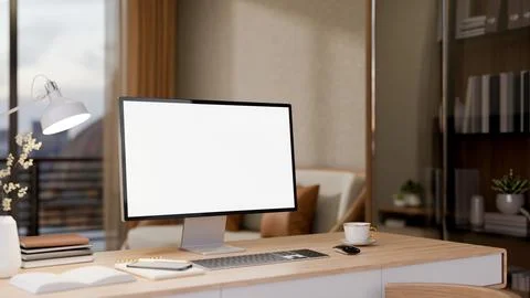 Blank screen computer on wooden table with coffee next to glass cabinet in .. イラスト素材