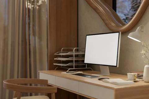 Blank screen computer on wooden table with chair under odd shape window in .. Stock Photos