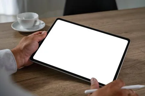Blank screen concept represented by a person holding a digital tablet with .. Stock Photos