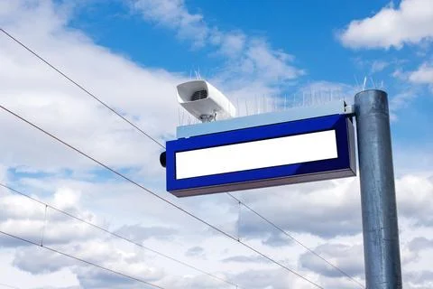 Blank Screen Display and Loudspeaker at Railway Station with Blue Sky Stock Photos