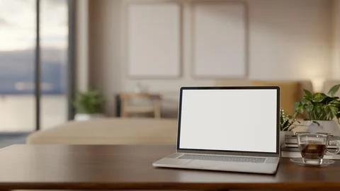 Blank screen laptop with coffee and pot plant on wooden table aside window .. イラスト素材
