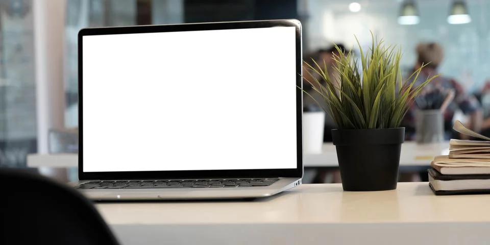 Blank screen Laptop computer and poster workspace background in modern office Stock Photos