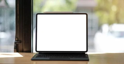 Blank screen Laptop computer and poster workspace background in modern office Stock Photos