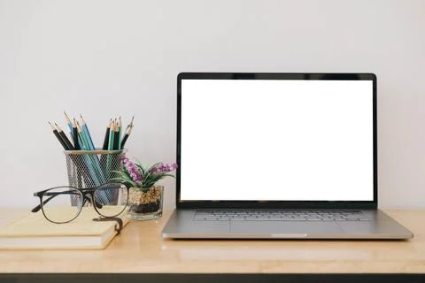Blank screen Laptop computer and poster workspace background in modern office Stock Photos