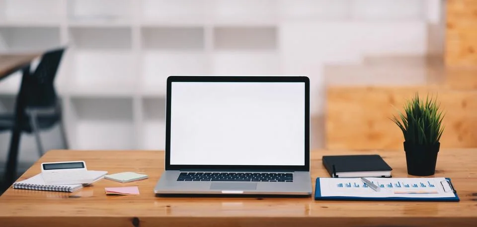 Blank screen Laptop computer and poster workspace background in modern office 스톡 사진