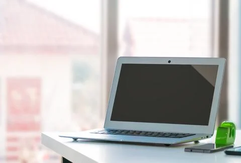 Blank Screen Laptop Computer Mock up on office desk for application website t Stock Photos