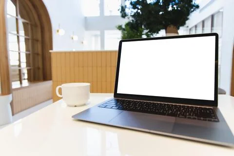 Blank screen laptop computer modern man use room laptop with blank white desk Stock Photos