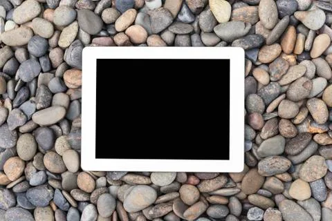 Blank screen tablet for text information with stone background. Abstract and Stock Photos