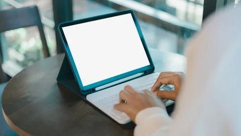 Blank screen tablet with white background for advertising text, Woman use t.. Stock Photos