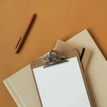 Blank sheet clipboard with empty copy space, pen on ginger background. Flat l Stock Photos