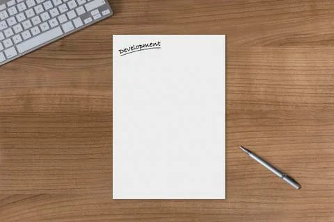 Blank sheet Development on a wooden table Stock Photos