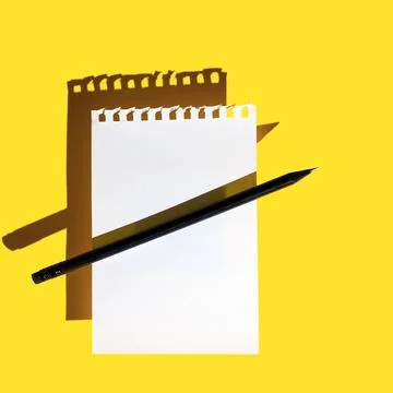 A blank sheet of Notepad, black pencil and hard shadows on bright yellow Stock Illustration
