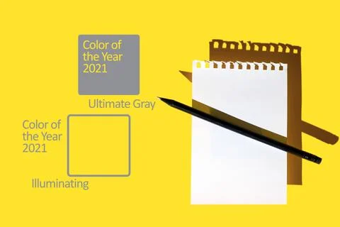 A blank sheet of Notepad, black pencil and hard shadows on bright yellow back Photos