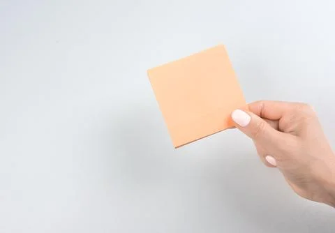Blank sheet for notes. female hand holding note paper mockup for making note. Stock Photos