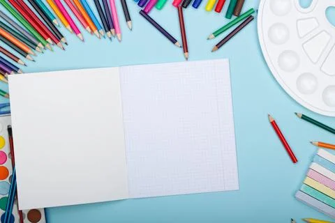 Blank sheet of paper of an open math notebook, art school supplies for painting Stock Photos