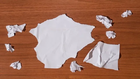 Blank sheet of paper reconstructs itself Stock Footage 120313379