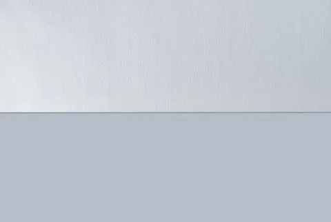 Blank sheet of paper split in half, isolated on white background with shadow  Foto stock