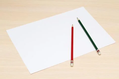 The blank sheet of paper with two colored pencils Foto stock