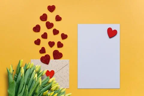 Blank sheet with red heart for text or write. Near an envelope with a hearts to Stock Photos