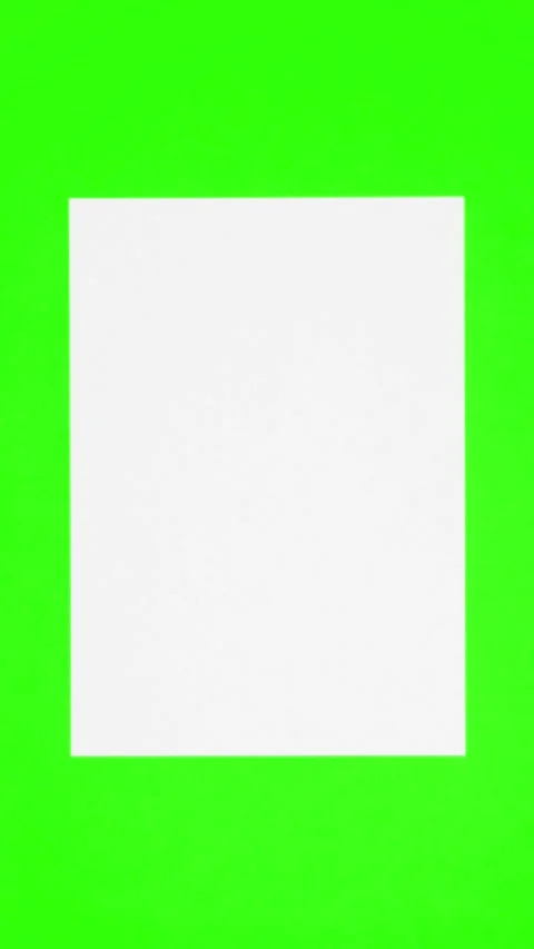 Blank sheet of white paper appears on green chroma key vertical background from Stock Footage 266101972