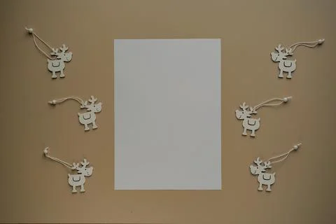 Blank sheets of paper with copy space for text and deers made of wood close.. Stock Photos