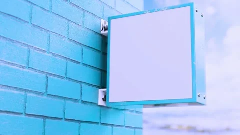 Blank sign on brick wall by ocean with gentle waves motion Stock-Footage 341801460