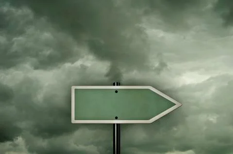 Blank signpost in front of cloudy sky Foto stock