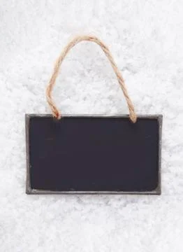 Blank slate chalkboard on snow Stock Photos