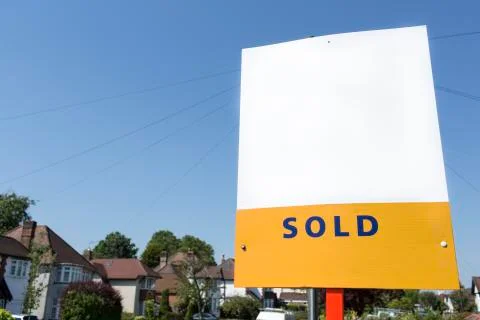 Blank SOLD sign outside a building, space for text to be added Stock Photos