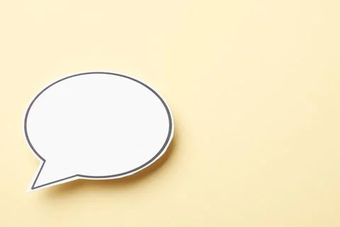 Blank speech bubble on beige background. Space for text Stock Photos