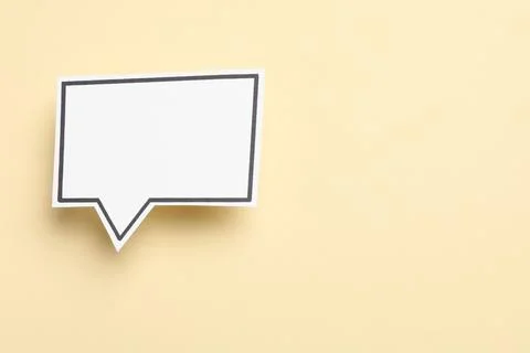 Blank speech bubble on beige background, top view. Space for text Stock Photos