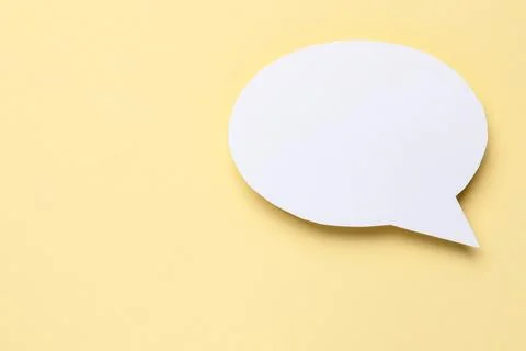 Blank speech bubble on beige background. Space for text Stock Photos