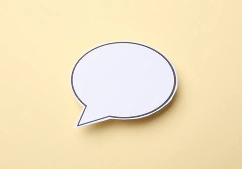 Blank speech bubble on beige background. Space for text Stock Photos