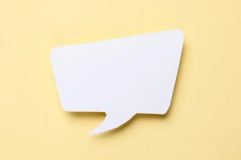 Blank speech bubble on beige background. Space for text Stock Photos