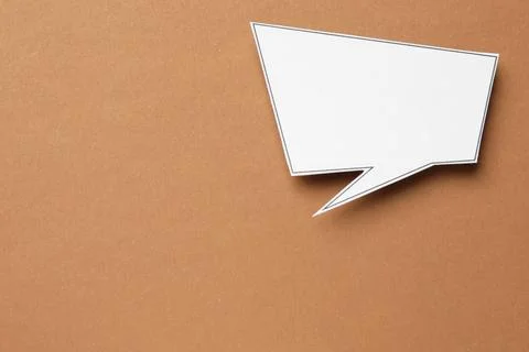 Blank speech bubble on brown background, top view. Space for text Stock Photos