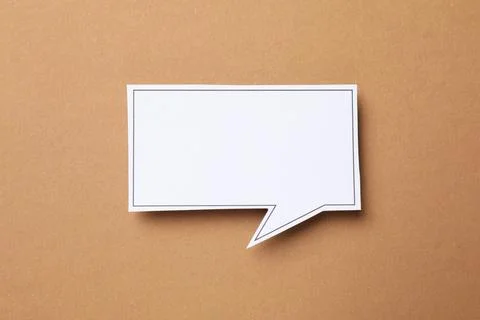 Blank speech bubble on brown background, top view. Space for text Stock Photos