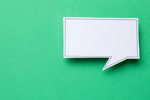 Blank speech bubble on green background, top view. Space for text Stock Photos