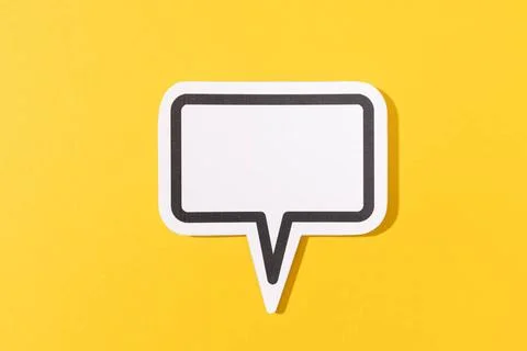 Blank Speech Bubble isolated on yellow background. Mock up template Blank ... Stock Photos