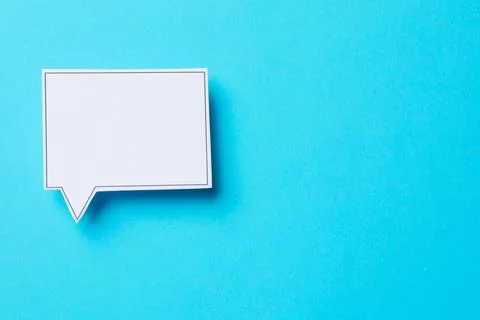 Blank speech bubble on light blue background, top view. Space for text Stock Photos