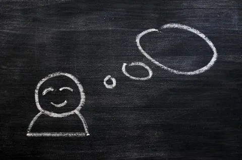 Blank speech bubble with a man figure drawn on a blackboard background Stock Photos