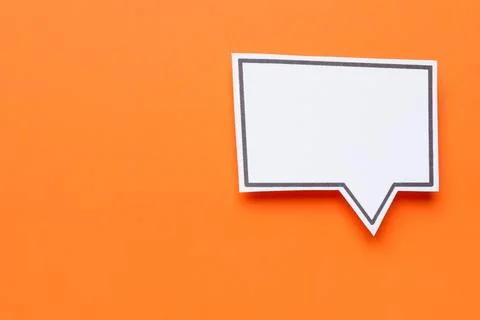Blank speech bubble on orange background, top view. Space for text Stock Photos