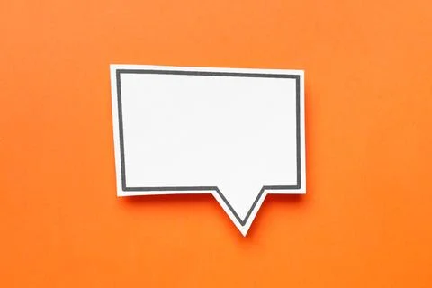 Blank speech bubble on orange background, top view. Space for text Stock Photos
