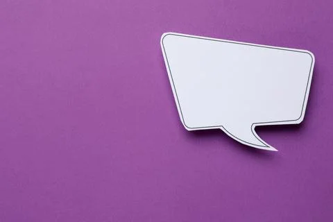 Blank speech bubble on purple background, top view. Space for text Stock Photos