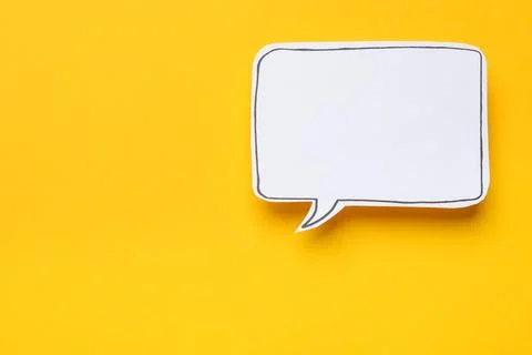Blank speech bubble on yellow background, top view. Space for text Stock Photos