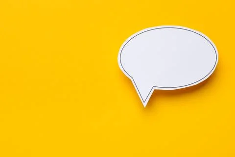 Blank speech bubble on yellow background, top view. Space for text Stock Photos