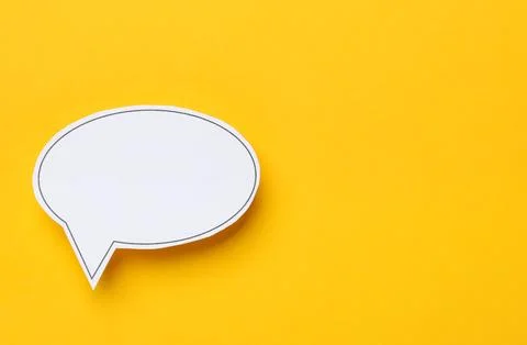 Blank speech bubble on yellow background, top view. Space for text Stock Photos
