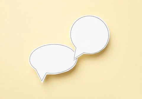 Blank speech bubbles on beige background, top view. Space for text Stock Photos
