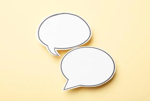 Blank speech bubbles on beige background. Space for text Stock Photos